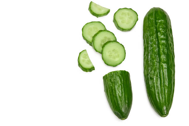 istock cucumber with slices isolated on white background. clipping path. top view 1306110412