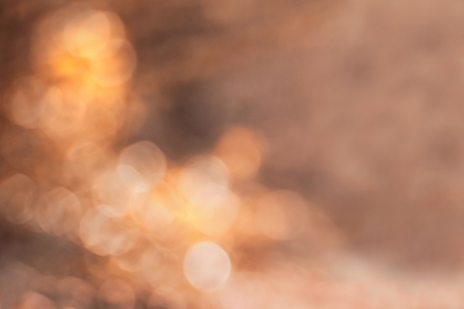 Abstract bokeh blur background with golden autum colors and copy space