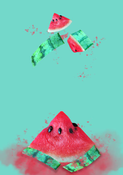 istock Pieces of Watermelon Splash on Green Background 1306113024