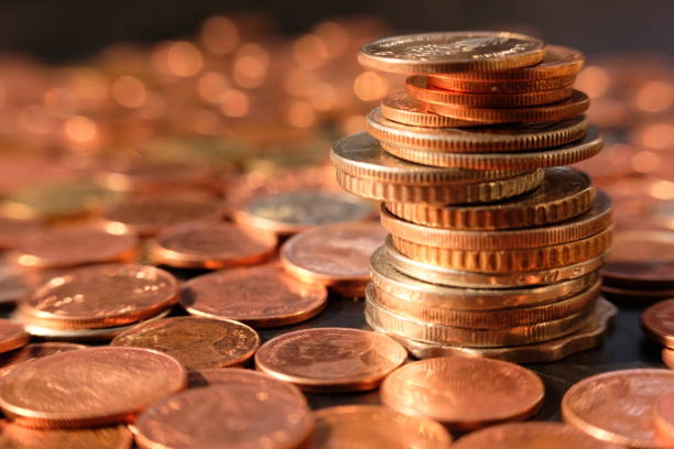 istock stack of coin on table background and business or finance saving money 1306114070