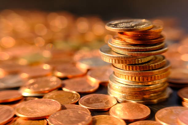 istock stack of coin on table background and business or finance saving money 1306114077
