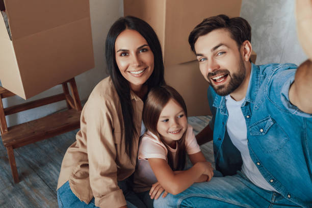 istock Handsome father taking a selfie with his wife and daughter 1306114578