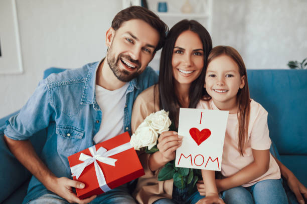 istock Cheerful mom posing with her daughter and husband 1306116129