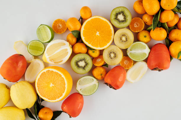 istock Juicy green and orange fruits 1306116194