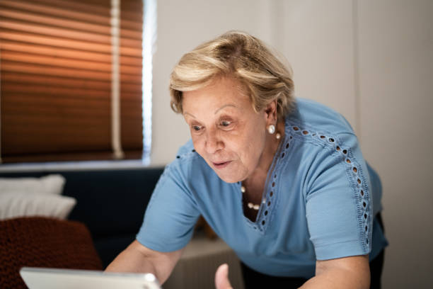 istock Senior woman doing a video call at home 1306117528