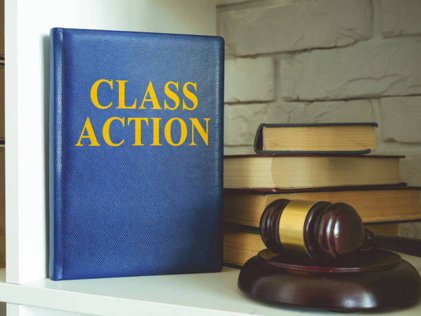 istock Book about class action lawsuit on the shelf. 1306118408