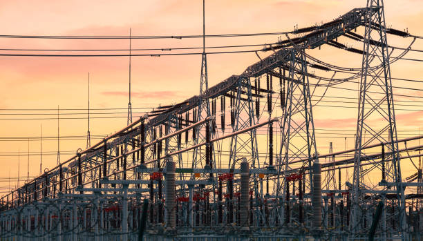 istock Power transmission infrastructure silhouettes at sunset. 1306118466