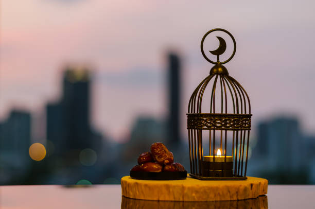 istock Lantern that have moon symbol on top and dates fruit for Ramadan Kareem. 1306119864