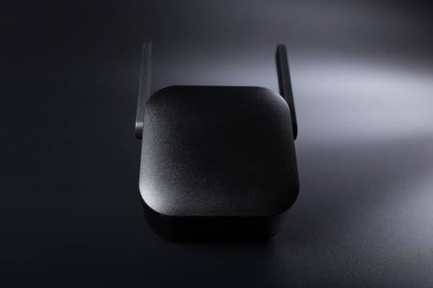 istock Wifi router close up. Wif amplifier on black 1306121620