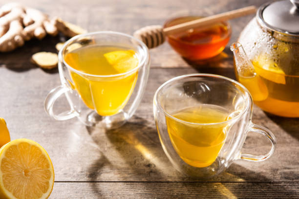 istock Ginger tea with lemon and honey in crystal glass 1306124249