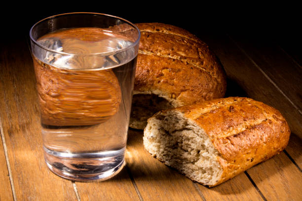 Fasting for bread and water Fasting for bread and water to strengthen the spirit prison meal stock pictures, royalty-free photos & images