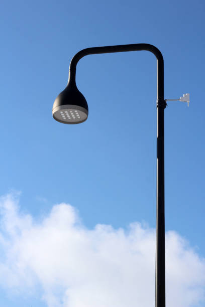 istock Solar powered electric city lantern on blue sky 1306127068