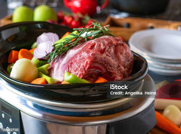 Roast Pork With Vegetables Stock Photo - Download Image Now - Crock Pot, Cooking, Meal