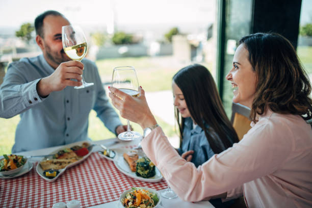 istock family having lunch at a restaurant 1306128386