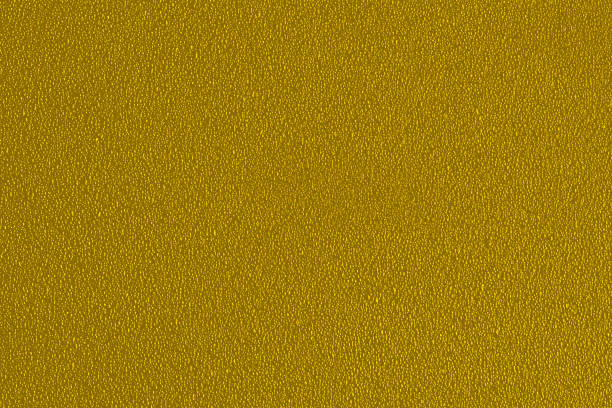 istock Yellow background with a fine texture. An empty flat and clean surface for information. The backdrop is advertising. 1306132413