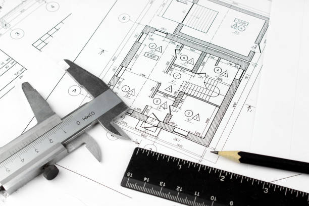 istock Construction drawings and plan tools. Close-up of Architect engineer drawing plan. 1306133450