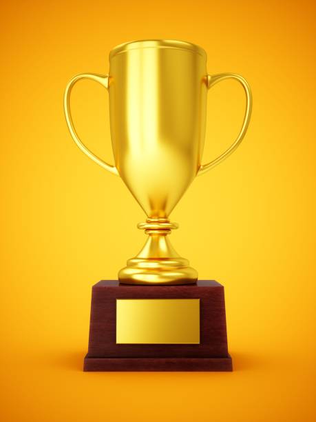 istock 3D Rendering Golden Award Trophy Cup isolated on yellow background 1306134487