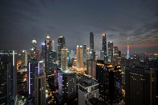 Singapore, Singapore - February 29, 2016: Marina Bay Sands Hotel and Casino of Downtown Core at night. Cityscape of luxury resort with swimming pool illuminated with light and reflected in the bay.