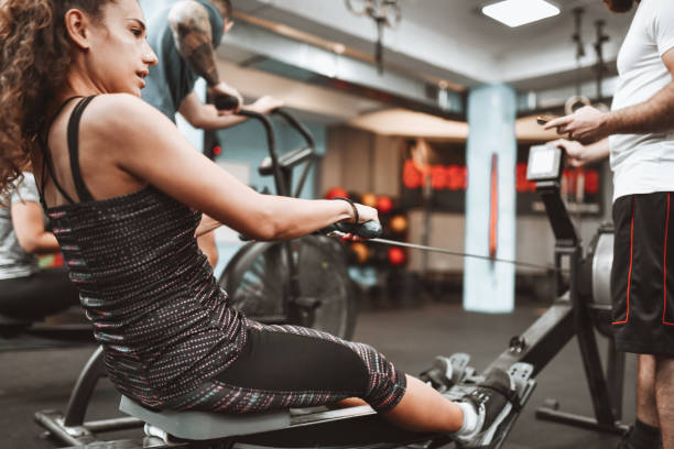 istock Female Giving Her Best While Working Out In Gym With Friends 1306136145