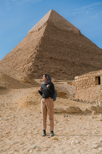 Woman walking near the Giza pyramids