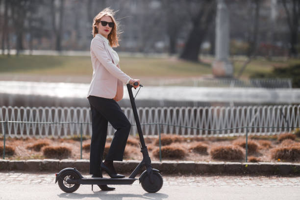 istock A young woman with electric scooter 1306138657