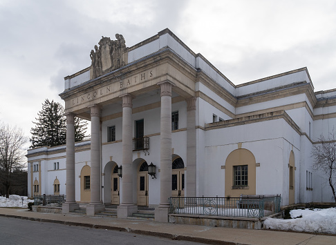 Saratoga Springs, NY - USA - Mar. 6, 2021: A three quarter view of the Lincoln Baths. The front has impressive large columns of Tennessee marble.