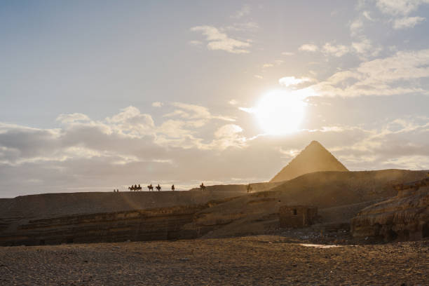 istock Scenic view of Giza pyramids at sunset 1306141486