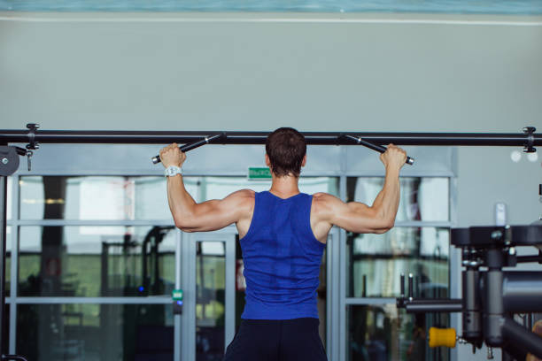 istock Man at the gym exercising 1306141573