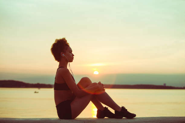 istock African girl athlete running at sunset 1306141621