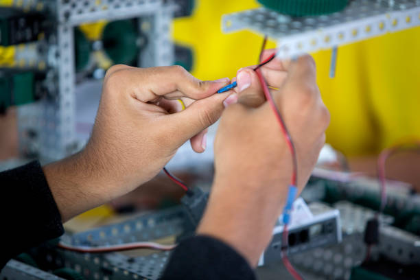 robotics contest at university Child, student, robotic, class, project, fit, robot, with plastic blocks key pegboard stock pictures, royalty-free photos & images