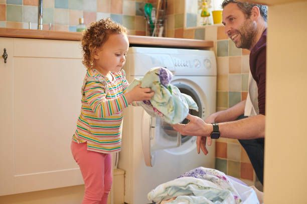 istock helping dad with the washing 1306143639