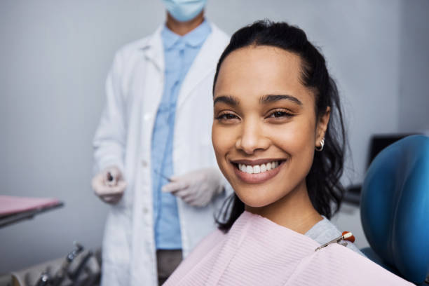 See what good dental health can do for your smile? Portrait of a young woman having dental work done on her teeth dentists chair stock pictures, royalty-free photos & images