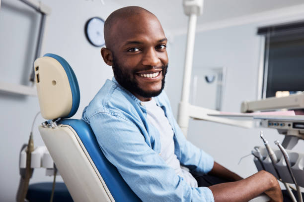 I got my smile back Portrait of a young man having dental work done on his teeth dentists chair stock pictures, royalty-free photos & images