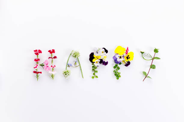 słowo happy napisane kwiatem wykonane listy - happy zdjęcia i obrazy z banku zdjęć