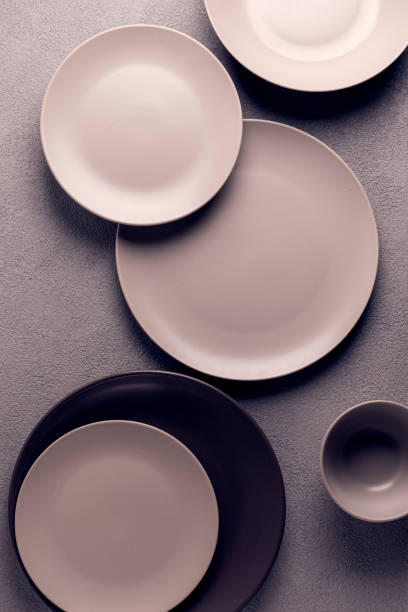 istock minimalistic composition of tableware, circles and shadows, gray and brown colors 1306144442
