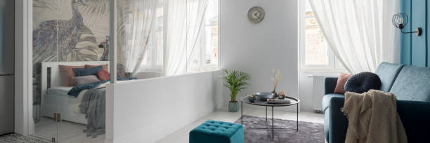 istock Glazed bedroom next to living room, panorama 1306144516