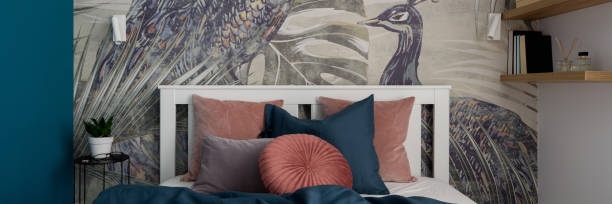 istock Decorated bed in charming bedroom, panorama 1306144528