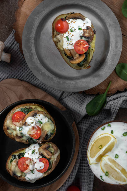 istock Baked Potatoes stuffed with mushroom and spinach 1306146779