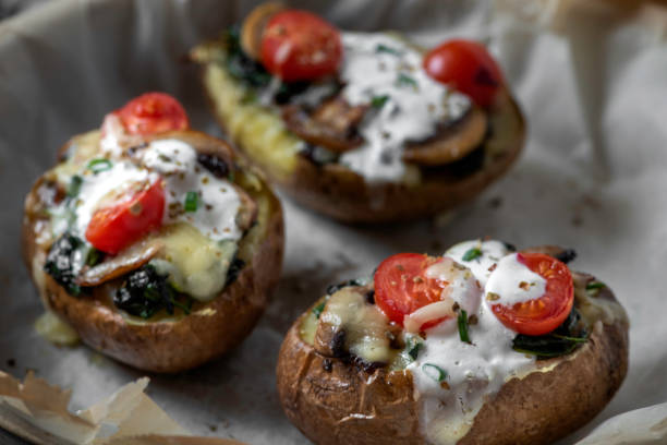 istock Baked Potatoes stuffed with mushroom and spinach 1306146897