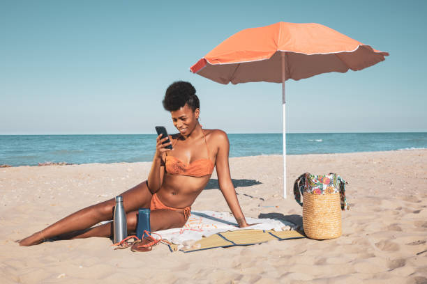 istock Happy woman on the beach 1306146927