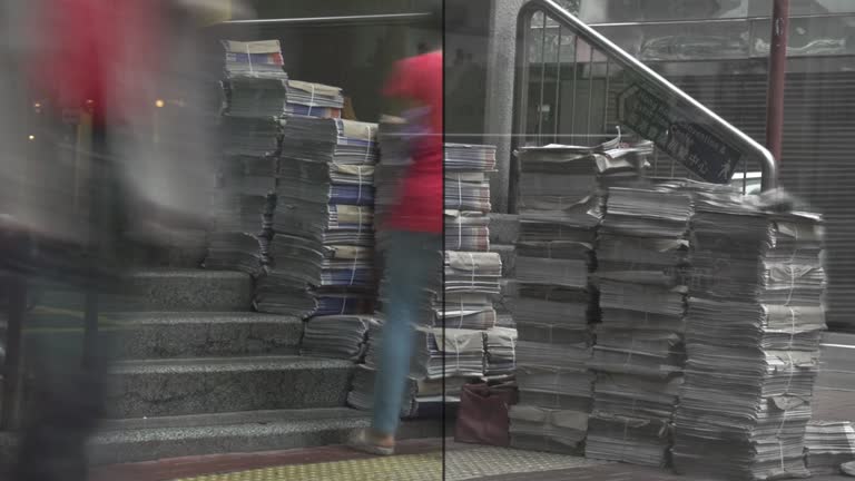 Hong Kong China Station Stairs Newspaper Seller from nobody to crowded cityscape