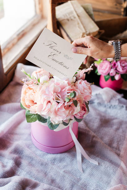 istock artificial flowers in pink cardboard box flower decoration 1306152743