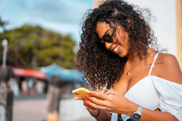 istock Young woman sending message by smartphone 1306153020
