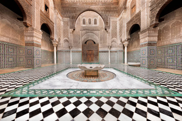 The Al-Attarine Madrasa or Medersa al-Attarine in Fez, Morocco The building was used to train Islamic scholars, particularly in Islamic law and jurisprudence fez morocco stock pictures, royalty-free photos & images