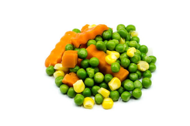 istock Peas carrots and corn isolated on white background 1306155977