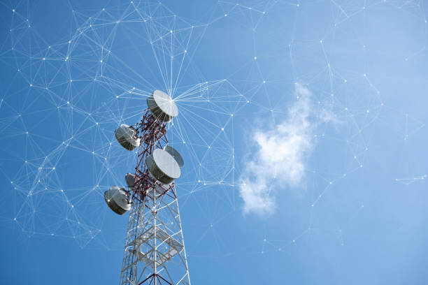 A tall telecommunications tower with circular antennas is prominently featured against a clear blue sky, embellished with an overlay of interconnected lines and nodes, evoking a sense of network connectivity.