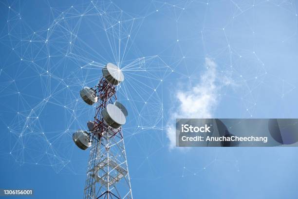 Telecommunication Tower With Mesh Dots Glittering Particles For Wireless Telecommunication Technology Stock Photo - Download Image Now