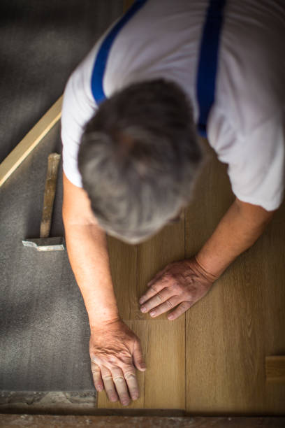istock senior man lying parquet floor board/laminate flooring 1306156865