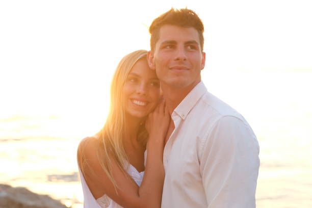istock Young couple on a wild beach. 1306158267