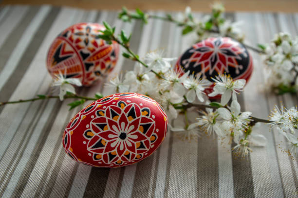 istock Homemade handmade painted Easter eggs on striped tablecloth decorated with blackthorn sloe branch 1306159408